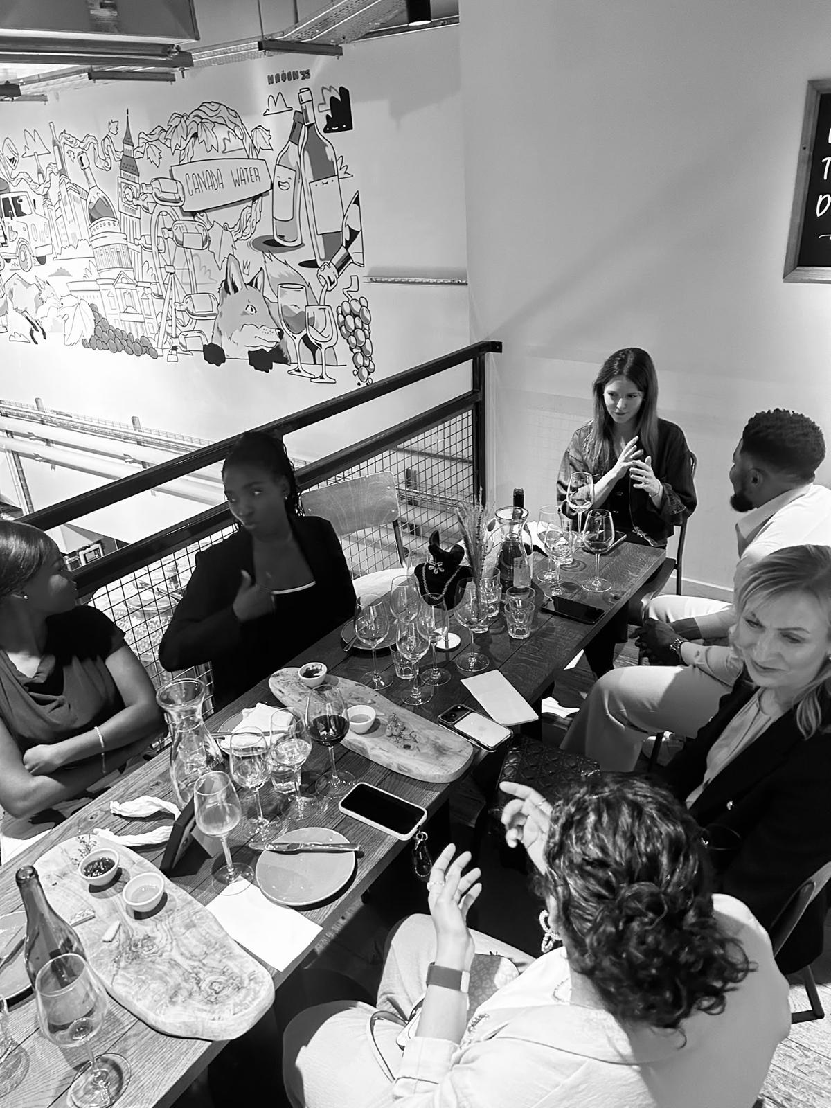 Guests deep in conversation around the table
